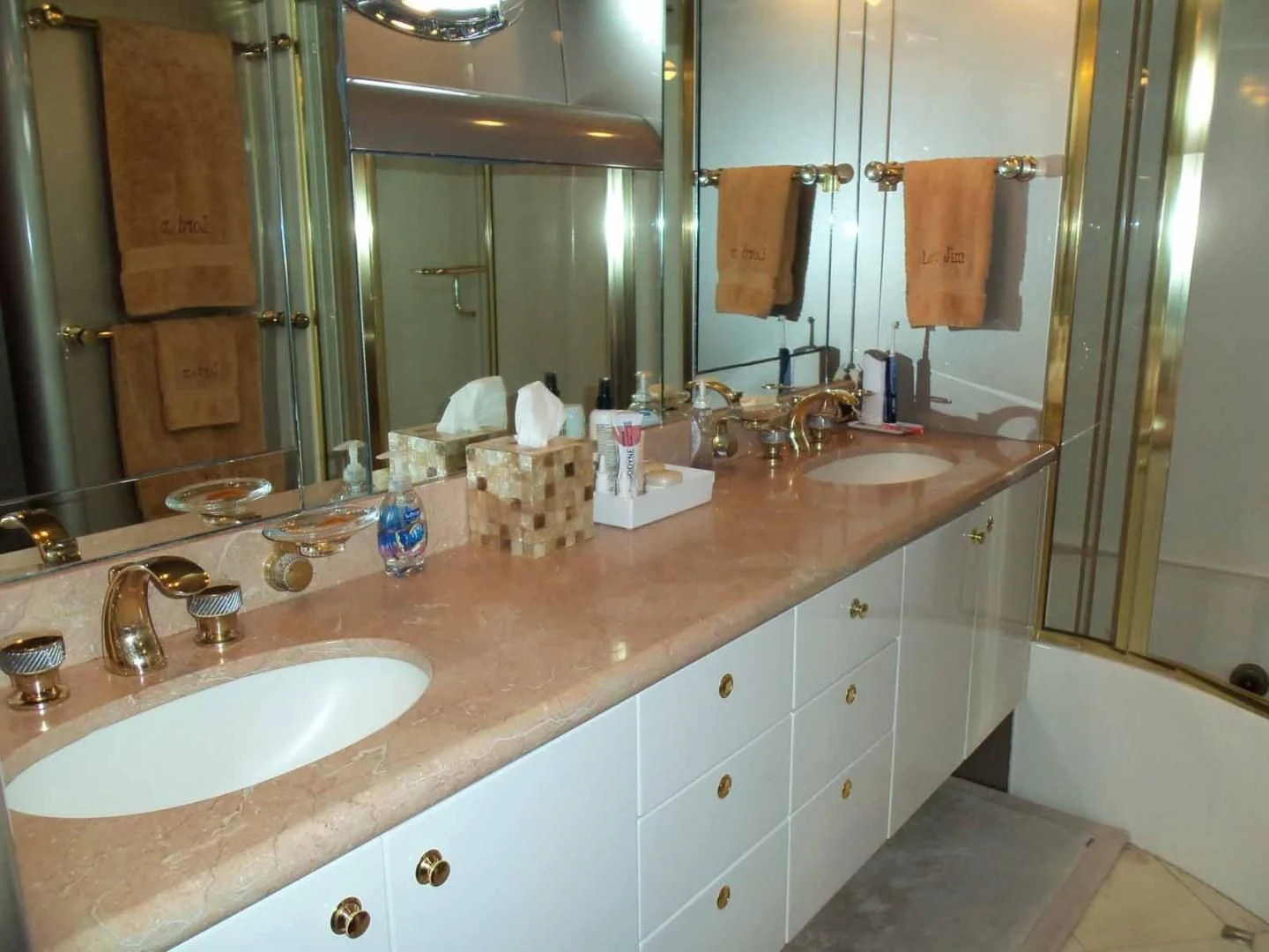 a bathroom with a large mirror aboard OHANA Yacht for Sale