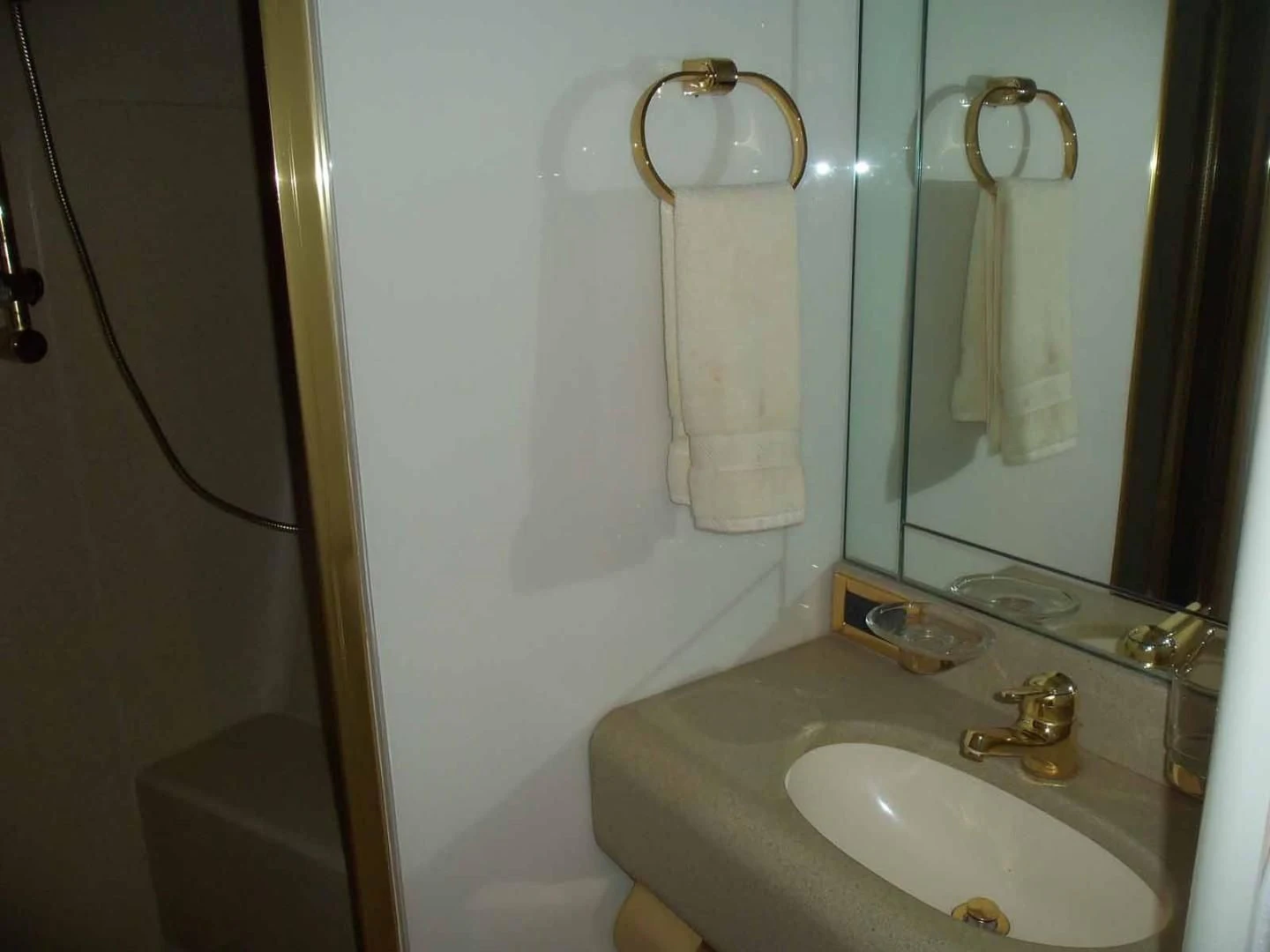 a bathroom with a sink and a mirror aboard OHANA Yacht for Sale