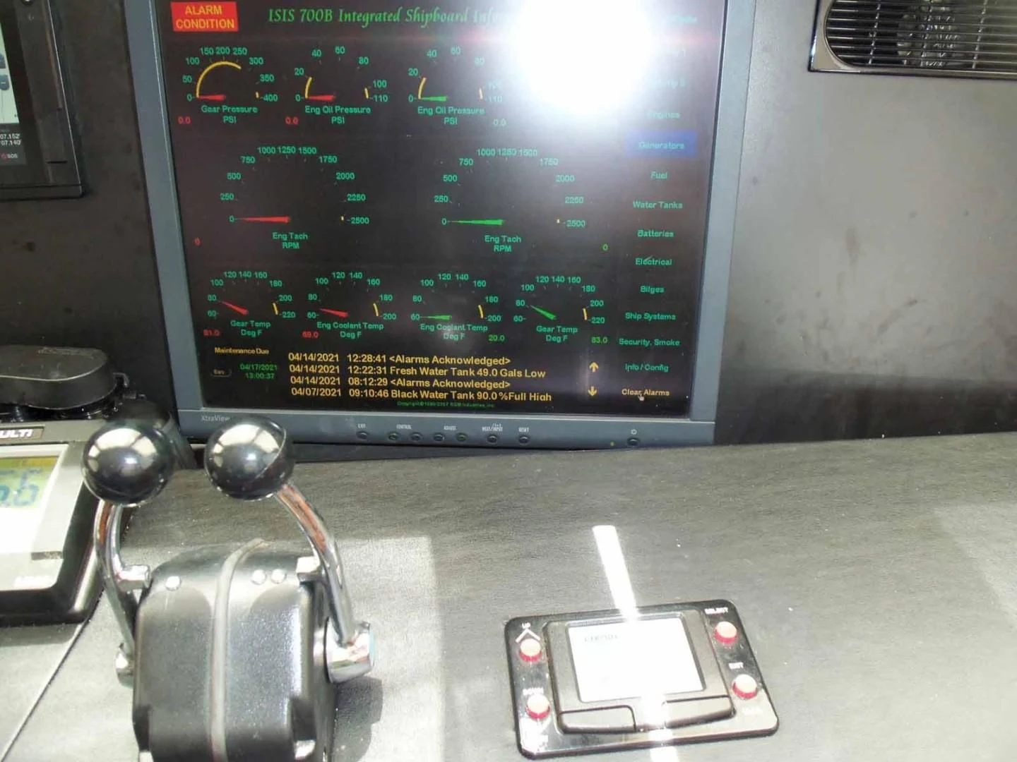 a video game console and controller aboard OHANA Yacht for Sale