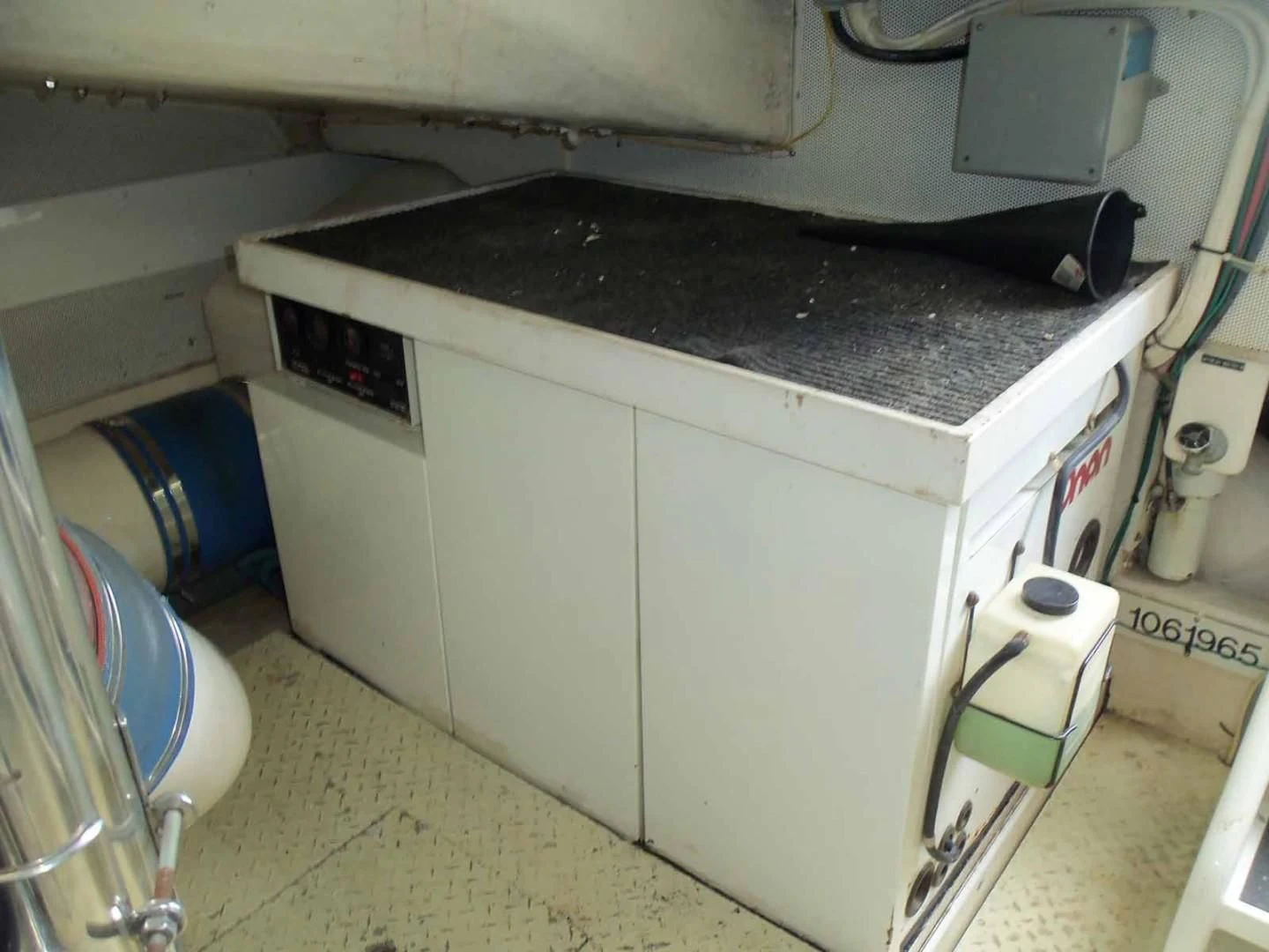 a white machine with black top aboard OHANA Yacht for Sale