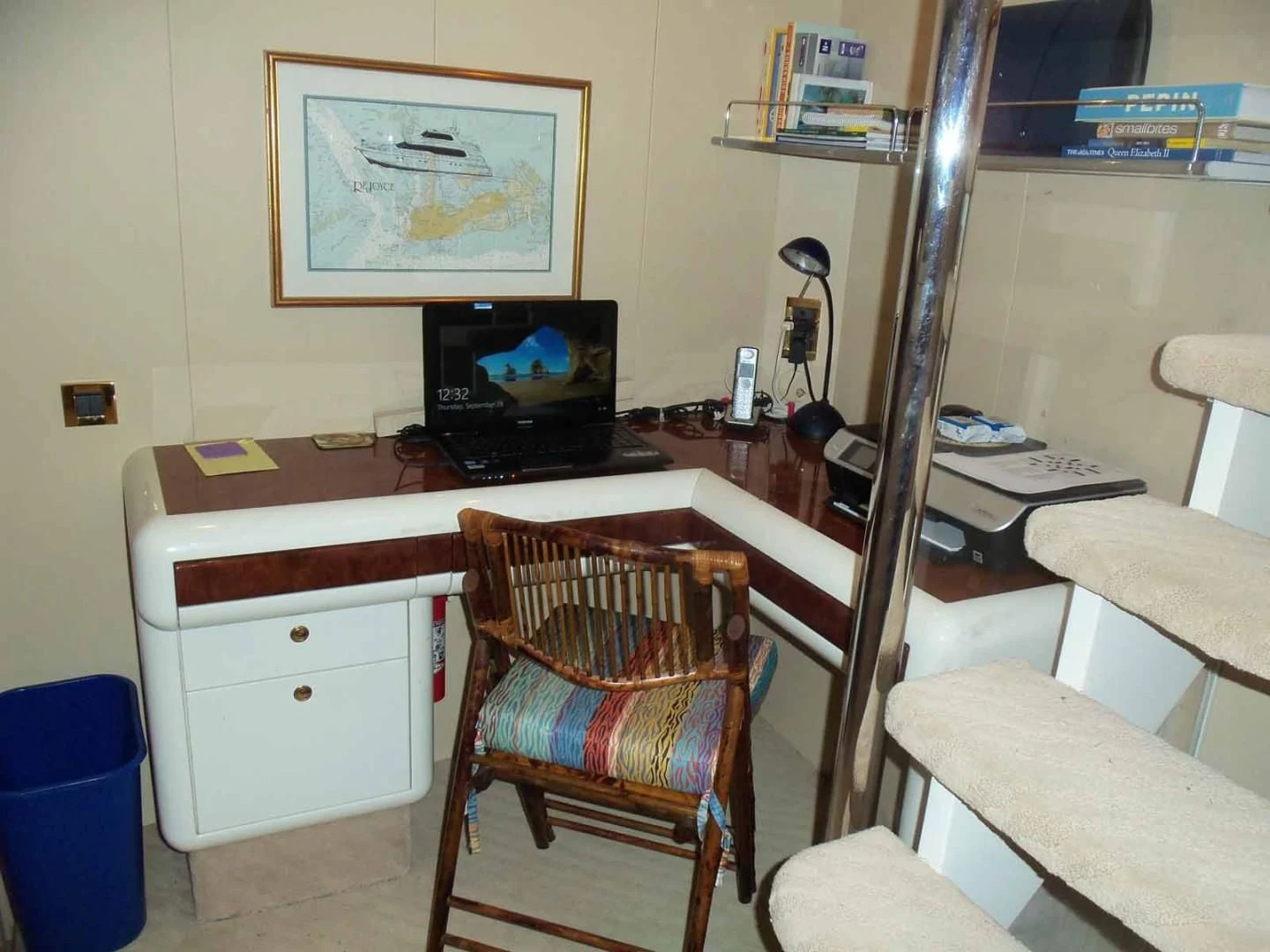 a chair and a desk in a room aboard OHANA Yacht for Sale