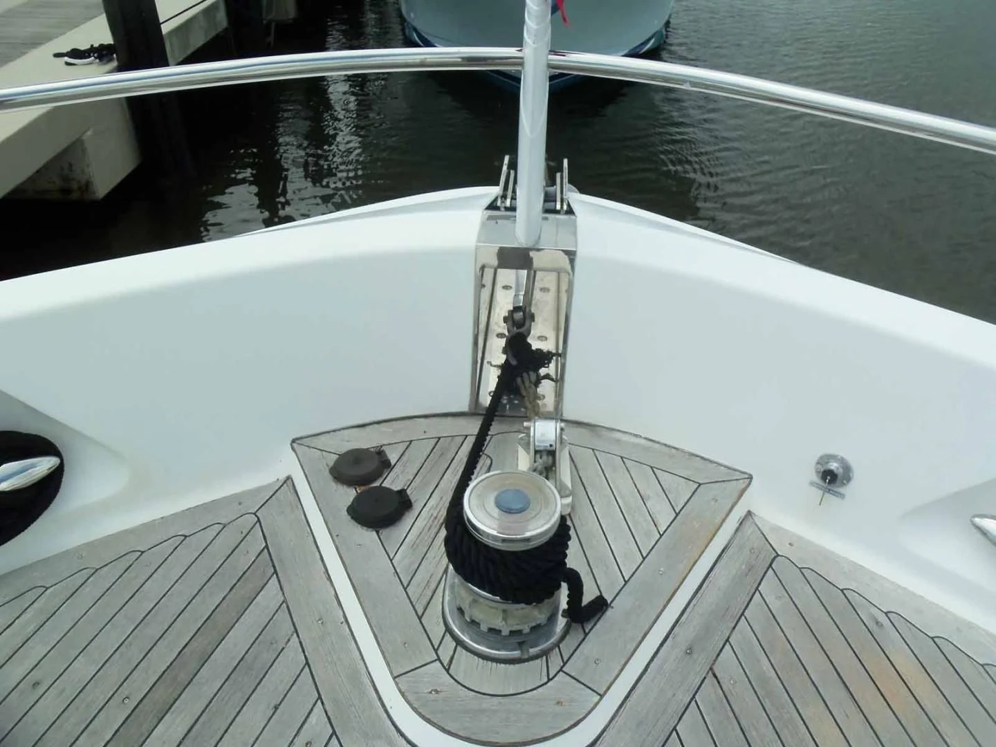 a guitar on a white piano aboard OHANA Yacht for Sale