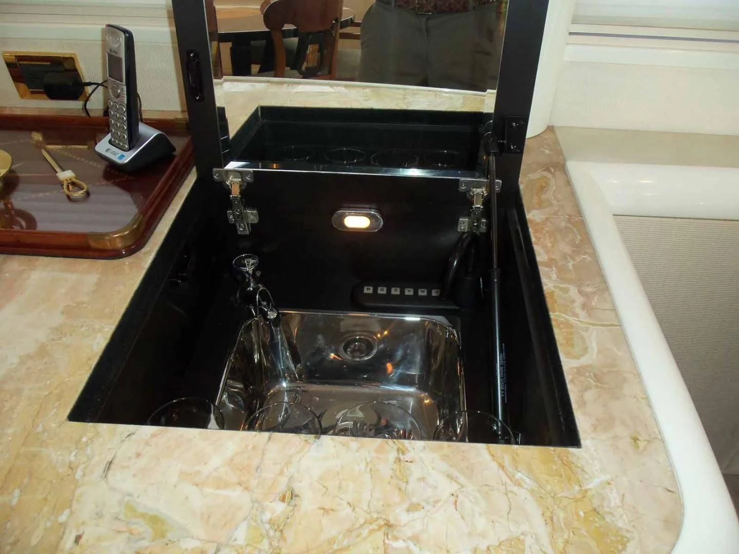 a black rectangular object with a silver object in it aboard OHANA Yacht for Sale