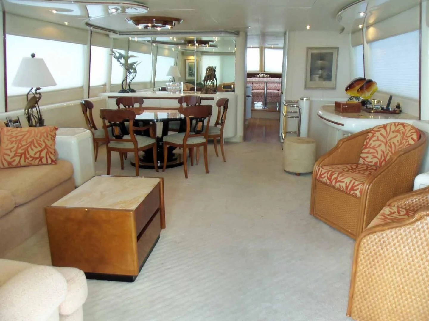 a living room with a table and chairs aboard OHANA Yacht for Sale
