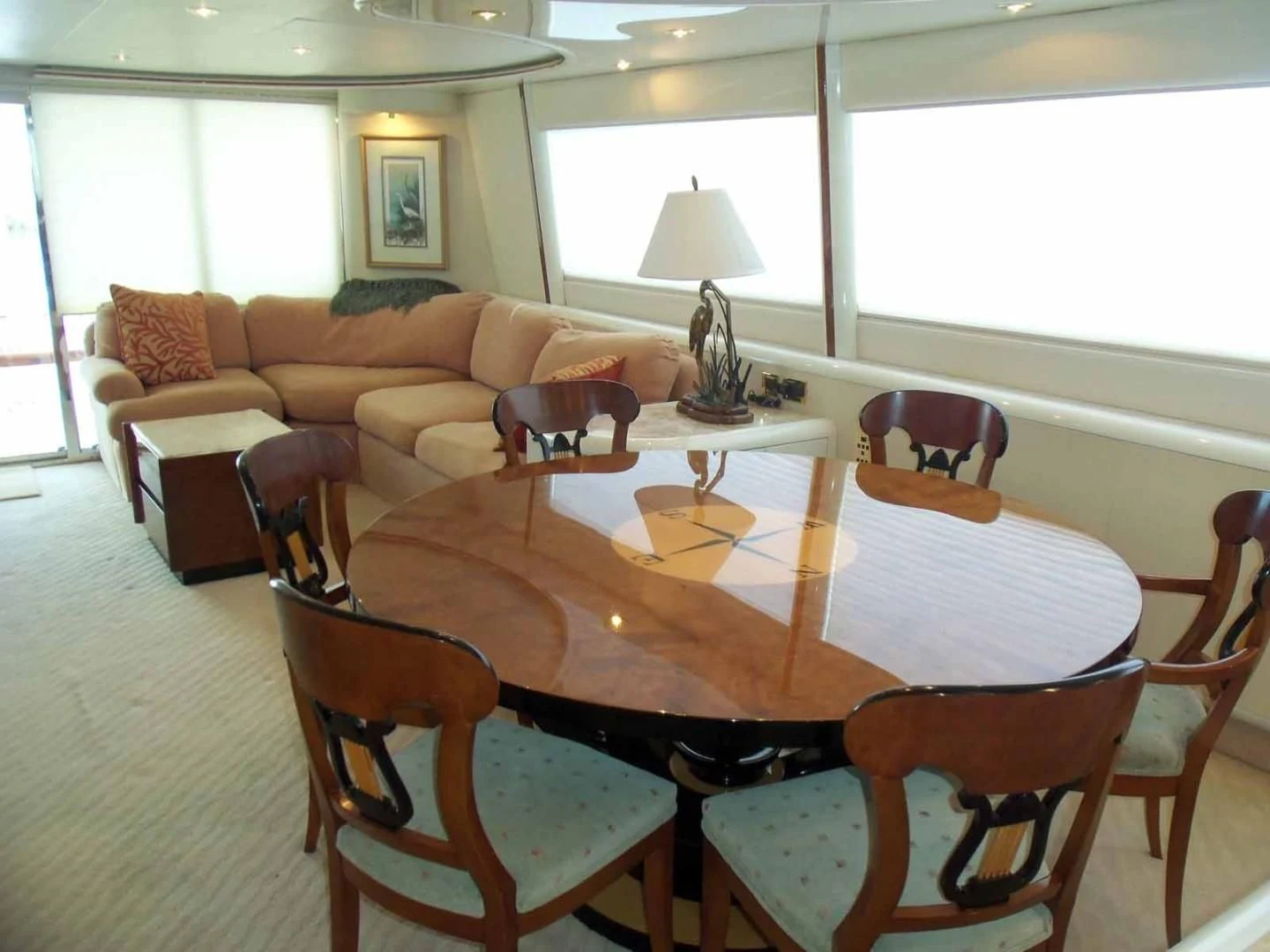 a dining table in a living room aboard OHANA Yacht for Sale