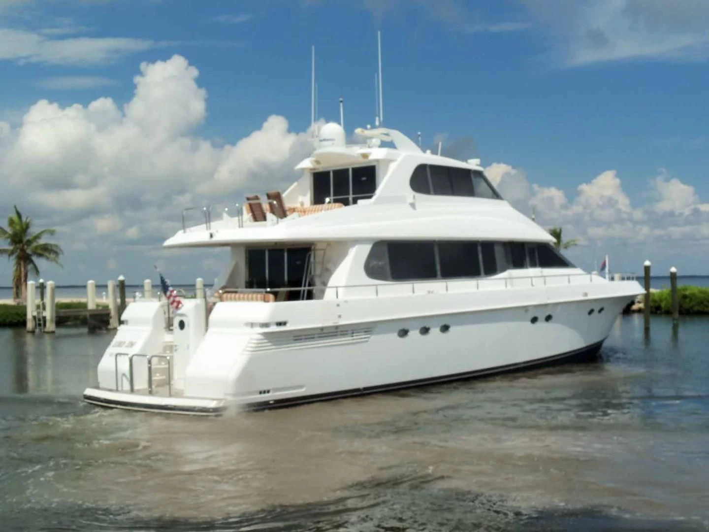 a white boat in the water aboard OHANA Yacht for Sale