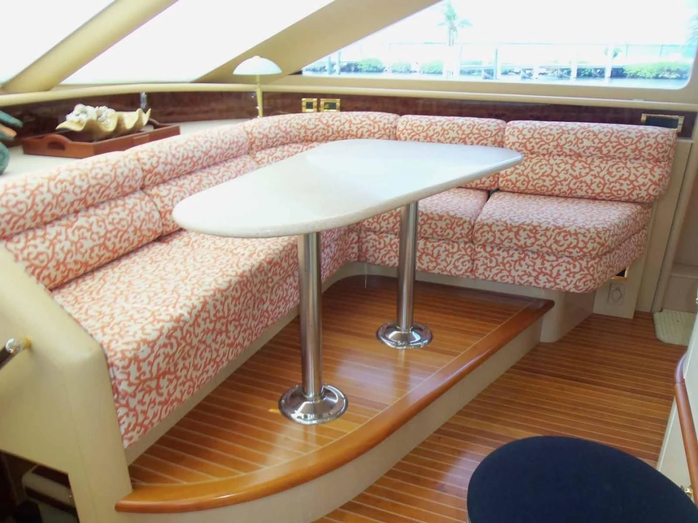 a table and a couch in a room aboard OHANA Yacht for Sale