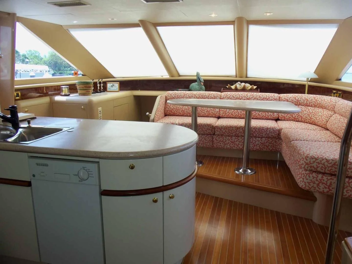 a kitchen with a table and chairs aboard OHANA Yacht for Sale
