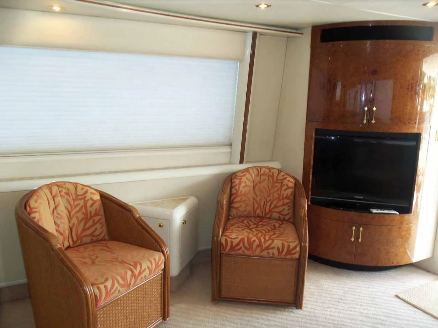 a chair and a chair in a room aboard OHANA Yacht for Sale
