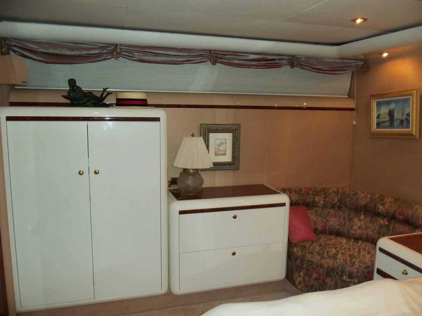 a room with a couch and a bed aboard OHANA Yacht for Sale