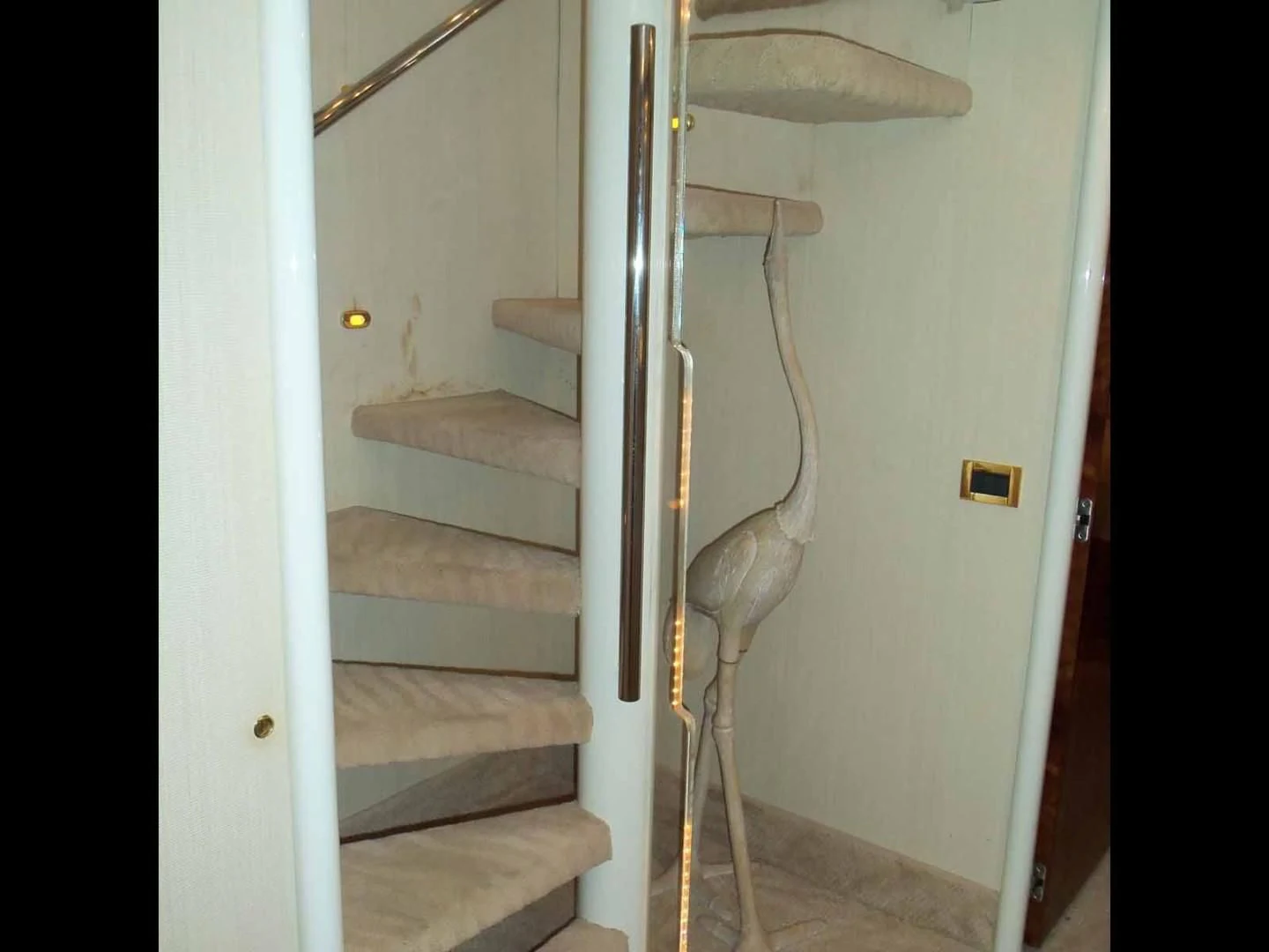 a staircase with a railing aboard OHANA Yacht for Sale