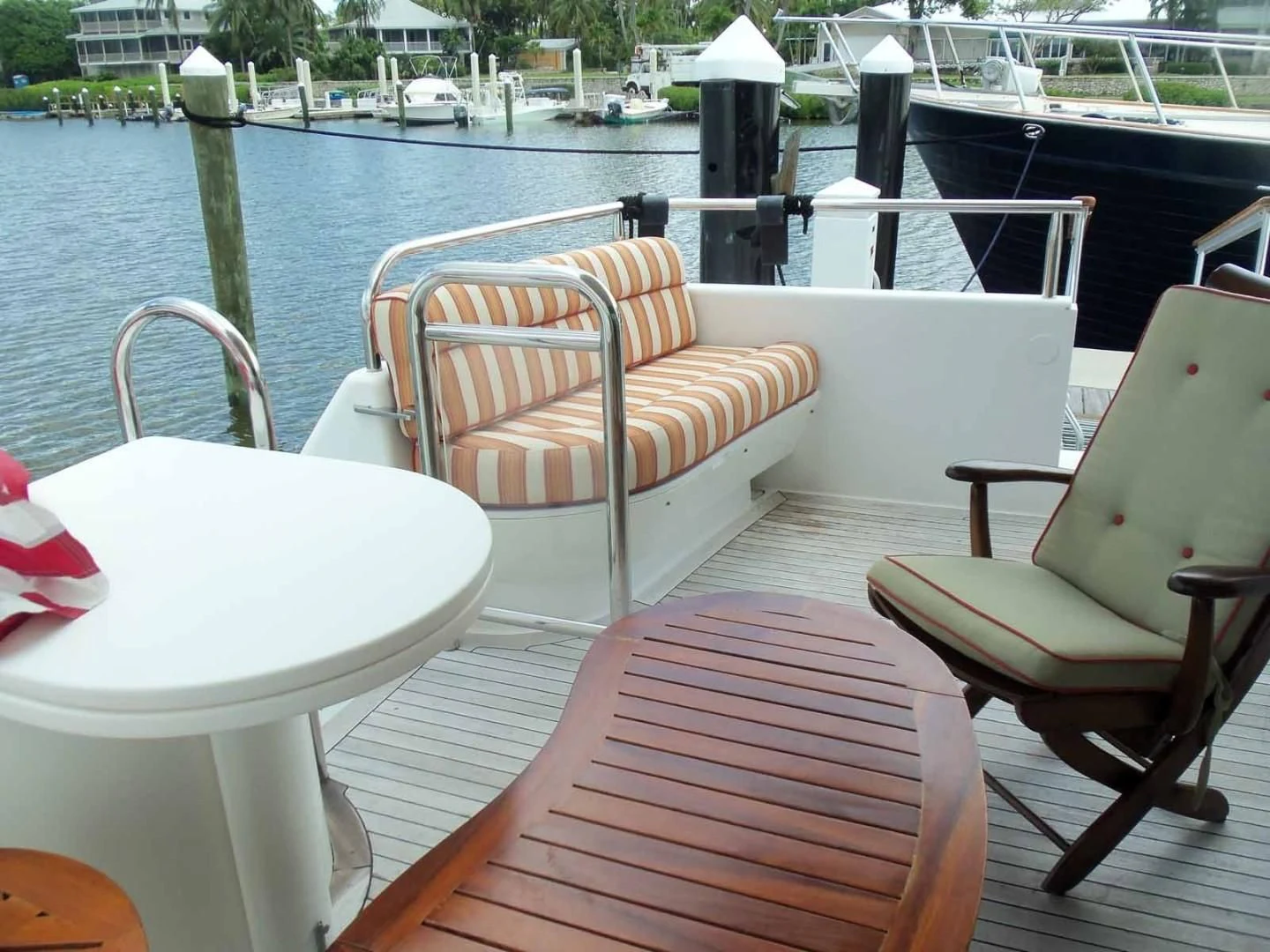 a table and chairs on a boat aboard OHANA Yacht for Sale