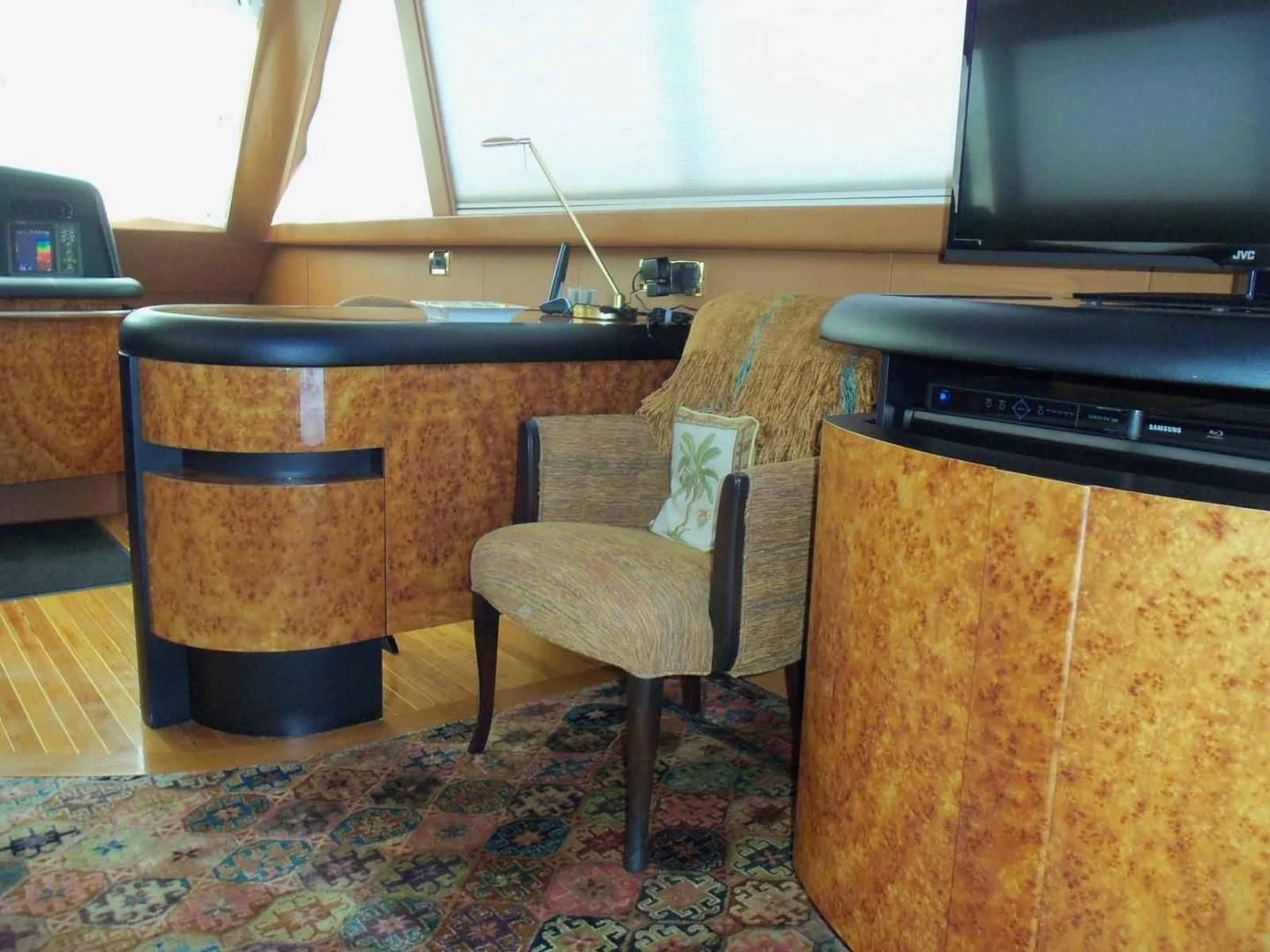 a room with a desk and a tv aboard OHANA Yacht for Sale