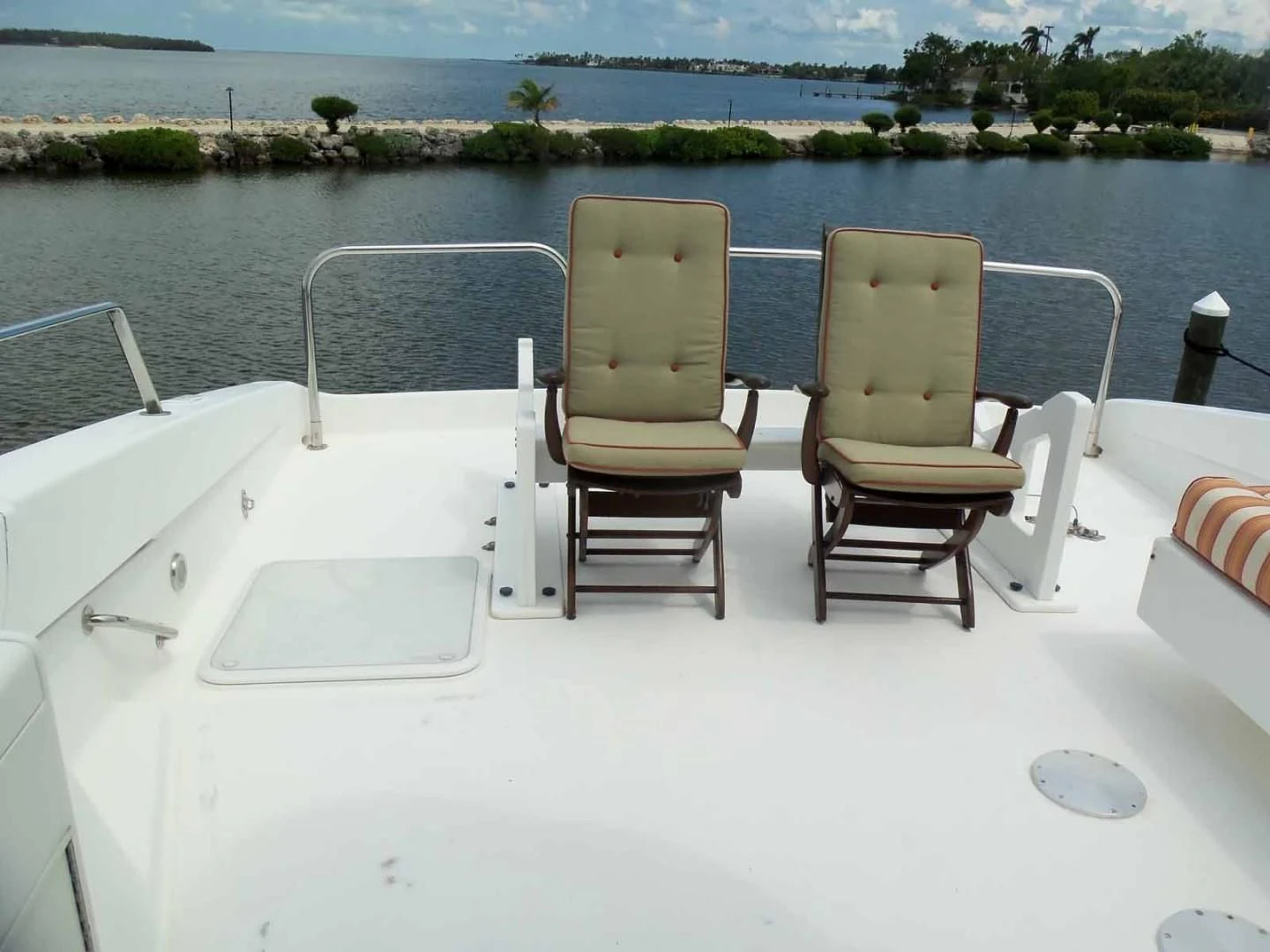 a group of chairs on a boat aboard OHANA Yacht for Sale