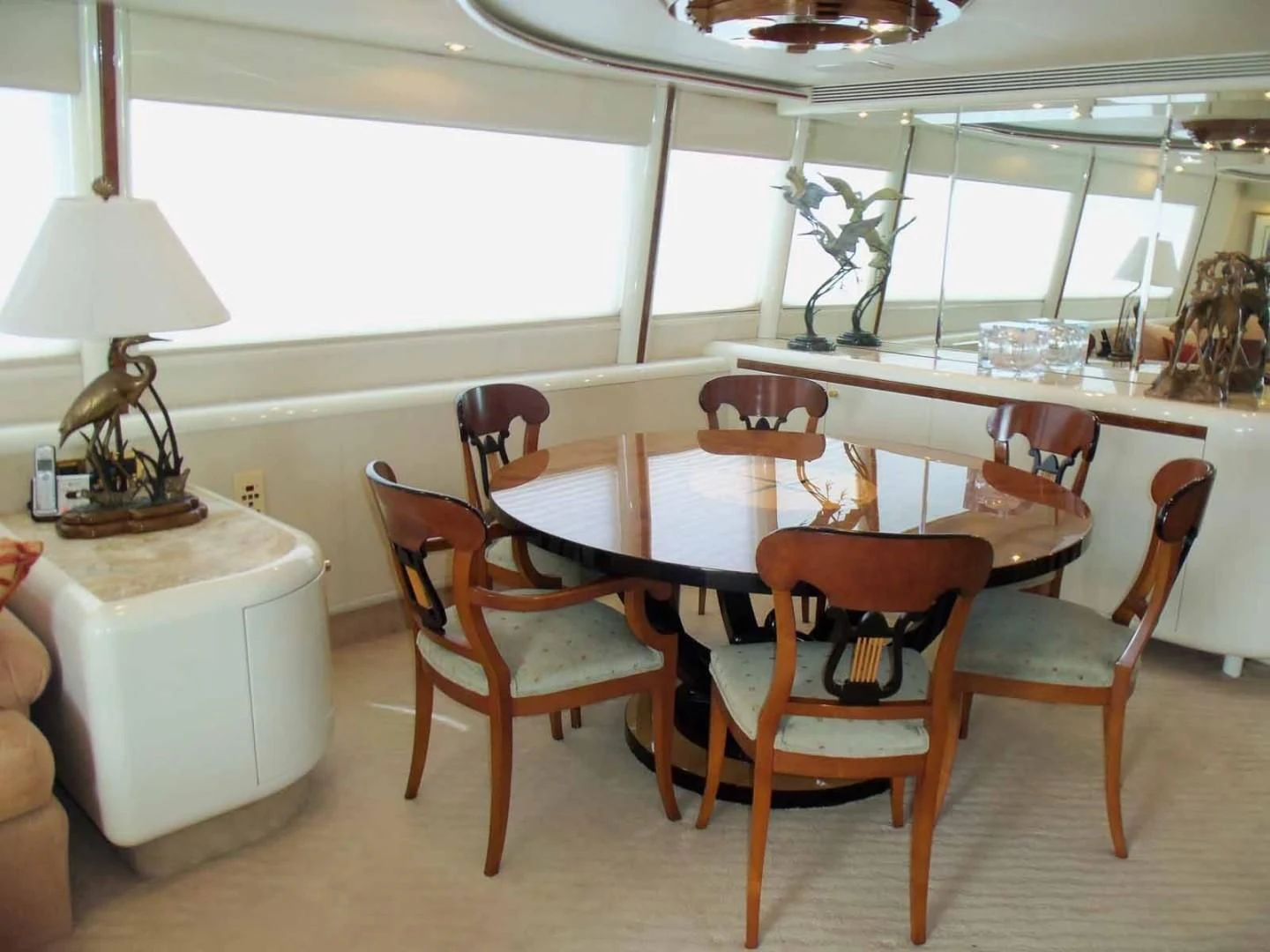 a dining room with a table and chairs aboard OHANA Yacht for Sale