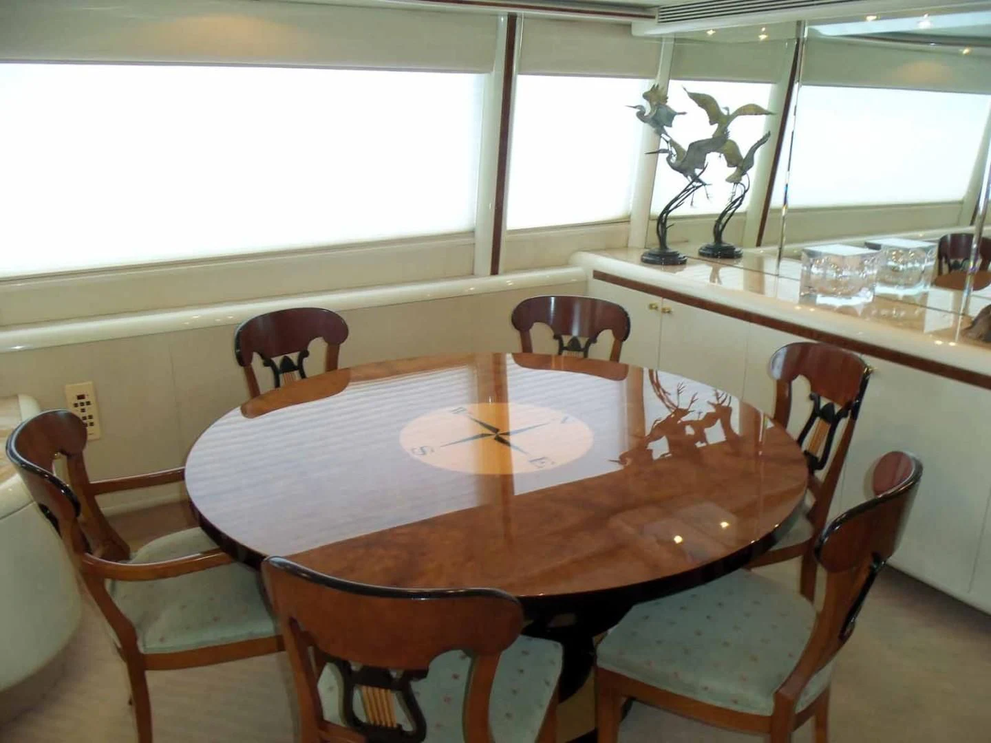 a dining table with glasses on it aboard OHANA Yacht for Sale
