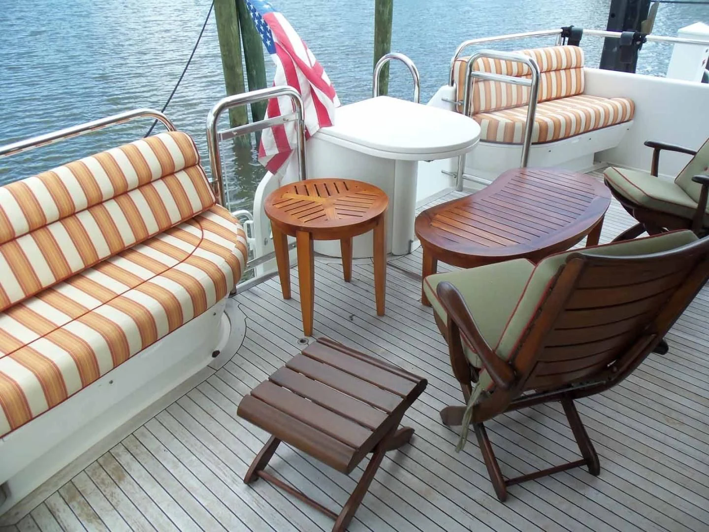 a group of chairs on a boat aboard OHANA Yacht for Sale