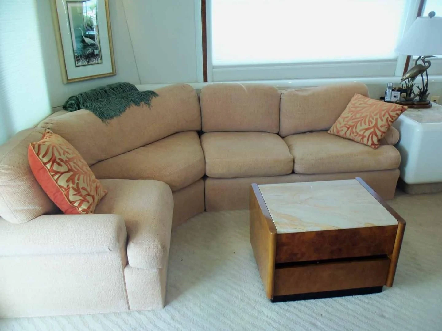 a couch with a coffee table aboard OHANA Yacht for Sale