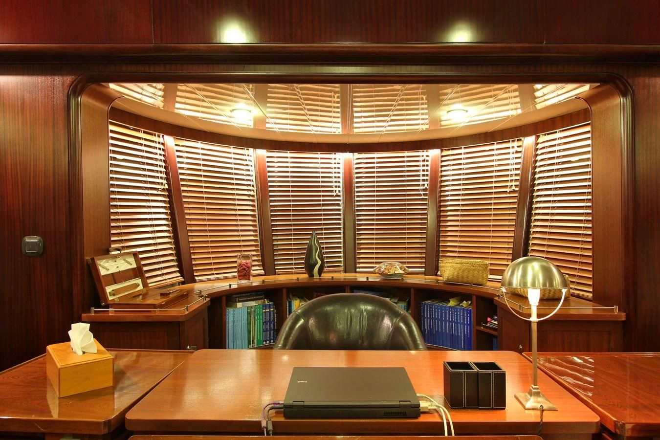 a room with a desk and a lamp aboard DOUCE FRANCE Yacht for Sale