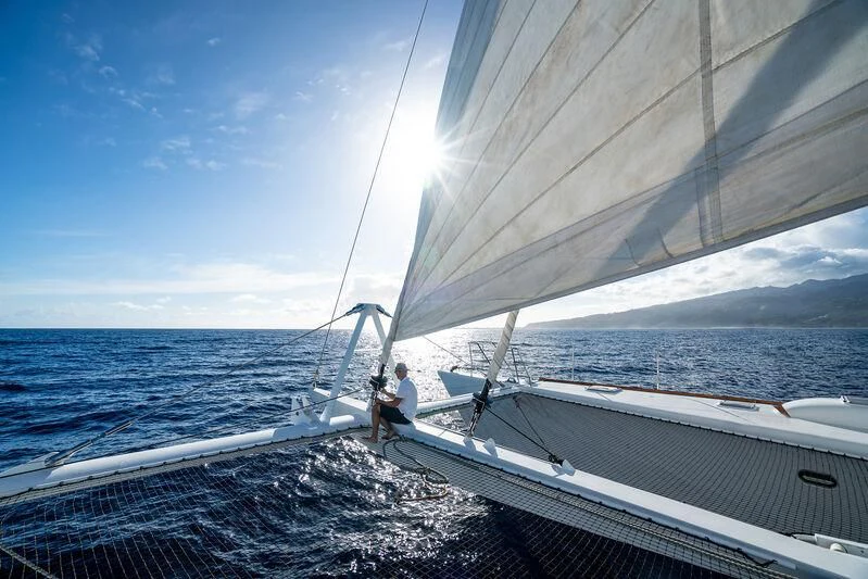 a person sailing on a boat aboard DOUCE FRANCE Yacht for Sale
