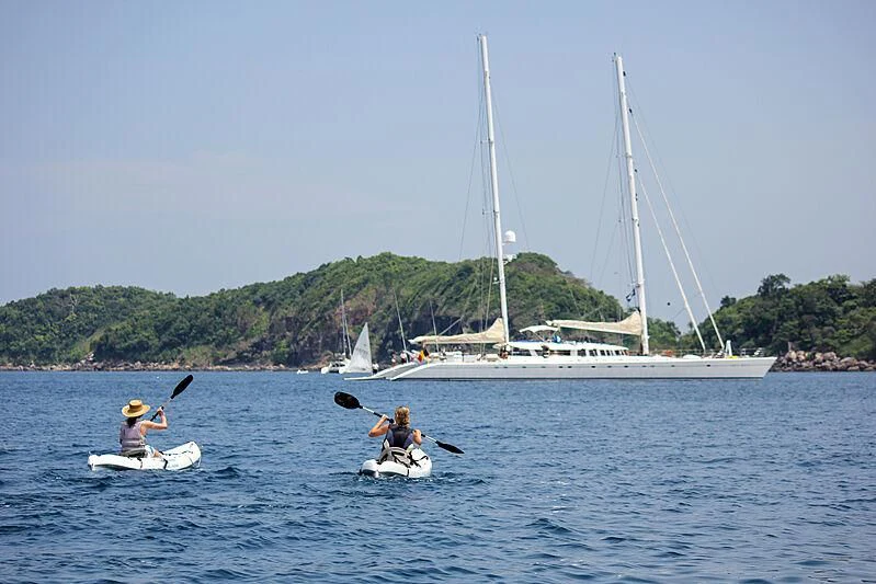 a group of people in a sailboat on the water aboard DOUCE FRANCE Yacht for Sale