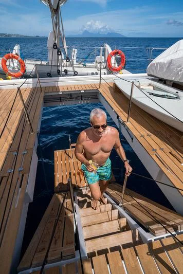 a person standing on a boat aboard DOUCE FRANCE Yacht for Sale