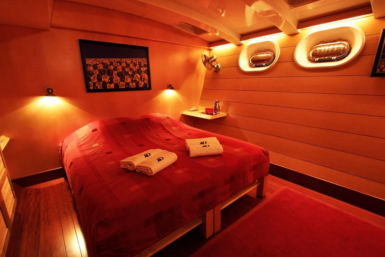 a bed in a room aboard DOUCE FRANCE Yacht for Sale