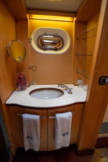 a bathroom with a sink and a mirror aboard DOUCE FRANCE Yacht for Sale
