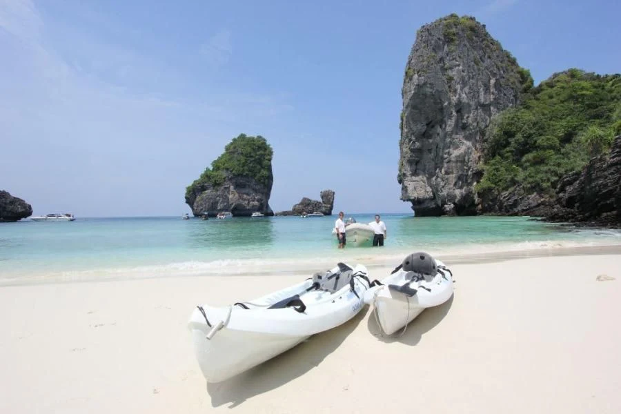 a couple of boats on a beach aboard DOUCE FRANCE Yacht for Sale