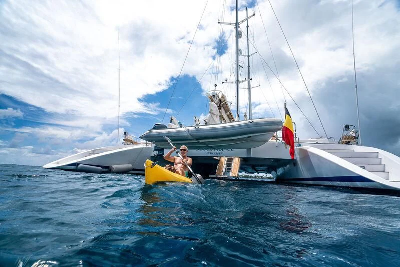 a man and a woman on a sailboat aboard DOUCE FRANCE Yacht for Sale