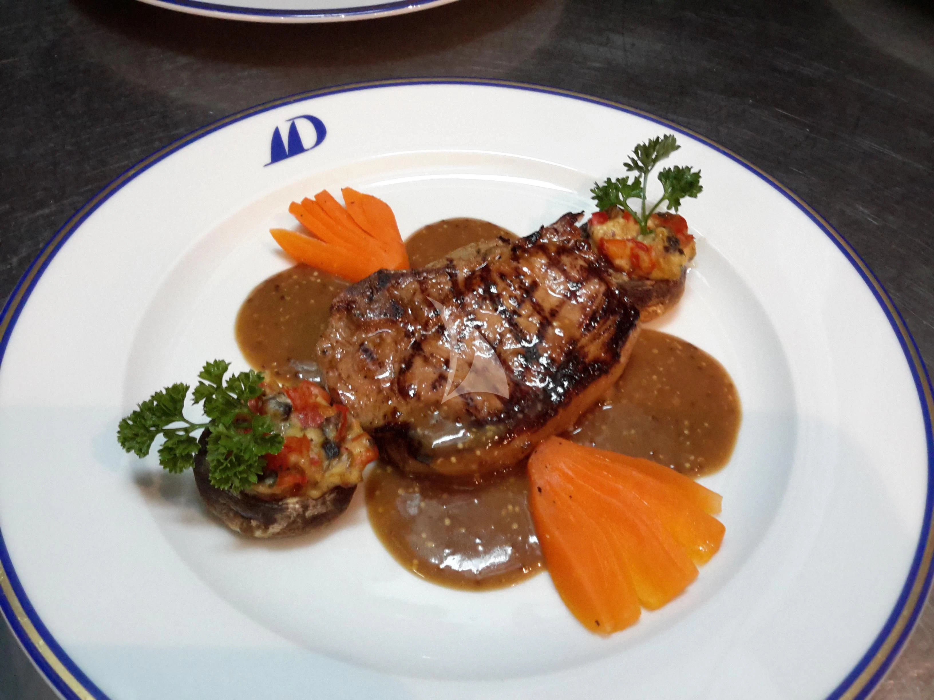 a plate of food aboard DOUCE FRANCE Yacht for Sale