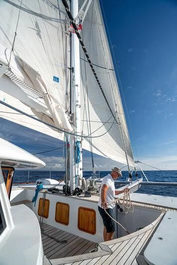 a person standing on a boat aboard DOUCE FRANCE Yacht for Sale