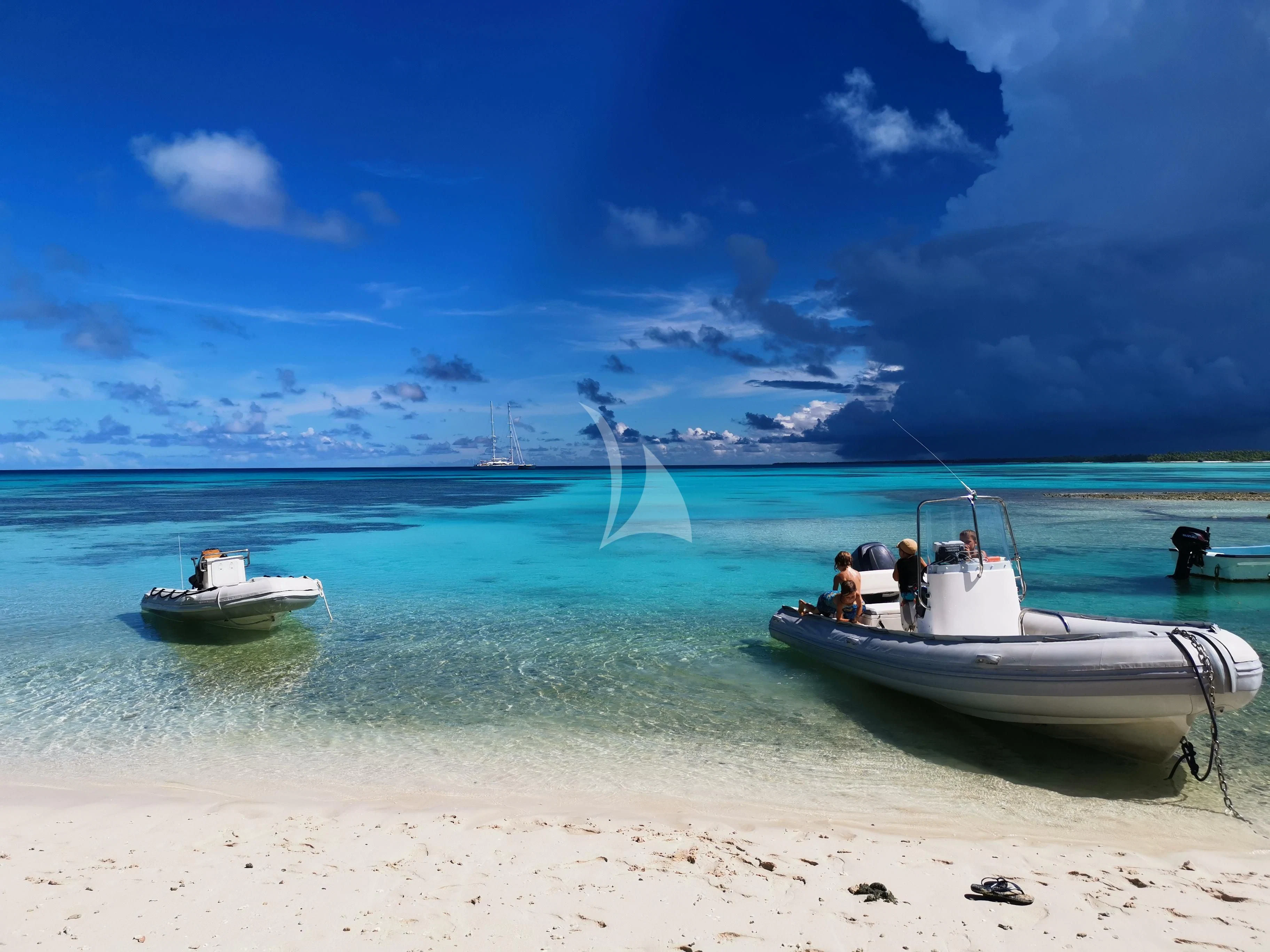 a group of boats on a beach aboard DOUCE FRANCE Yacht for Sale