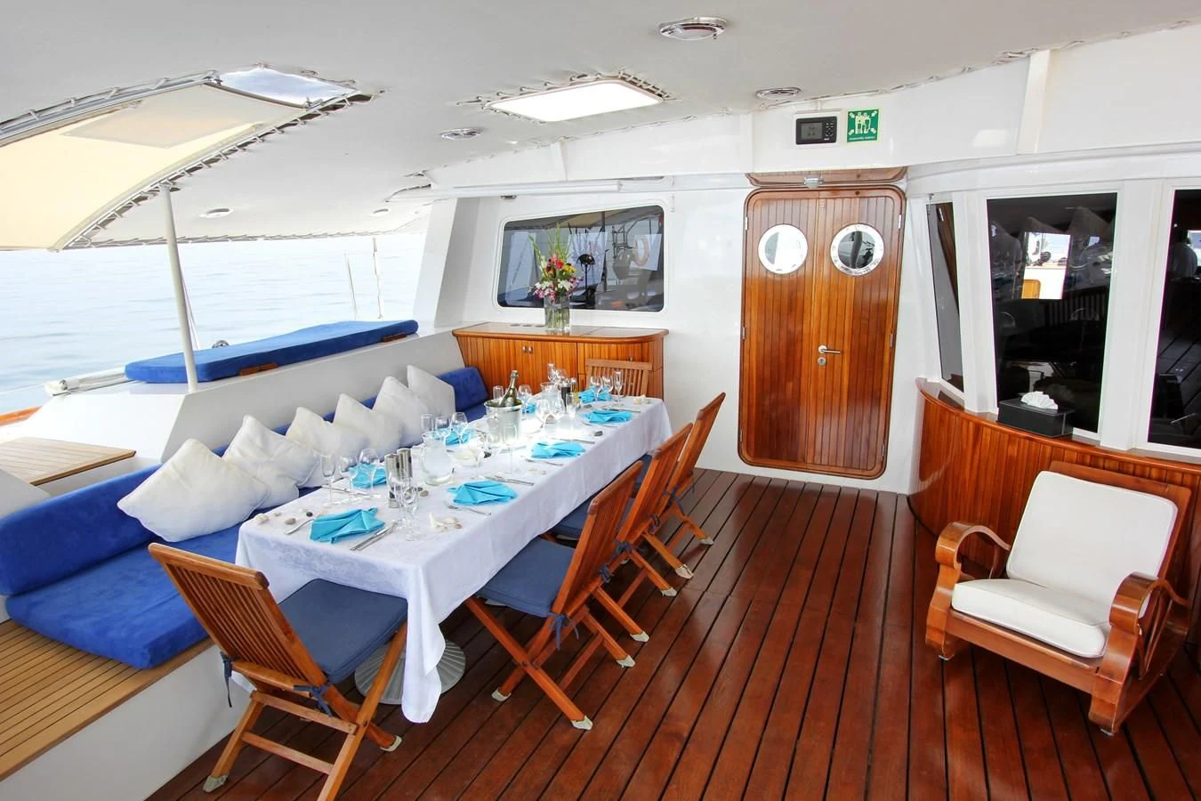 a room with a table and chairs aboard DOUCE FRANCE Yacht for Sale