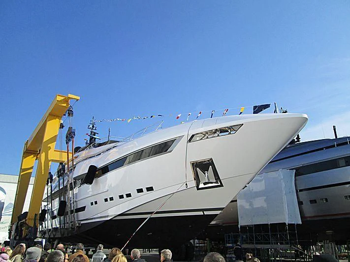 a large white airplane with a yellow crane on the front aboard PARAM JAMUNA IV Yacht for Sale