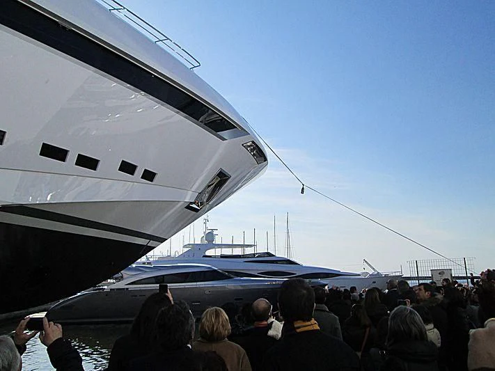 a group of people standing next to a plane aboard PARAM JAMUNA IV Yacht for Sale