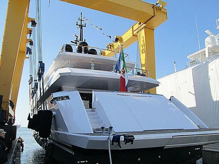 a large white boat with a crane on top aboard PARAM JAMUNA IV Yacht for Sale