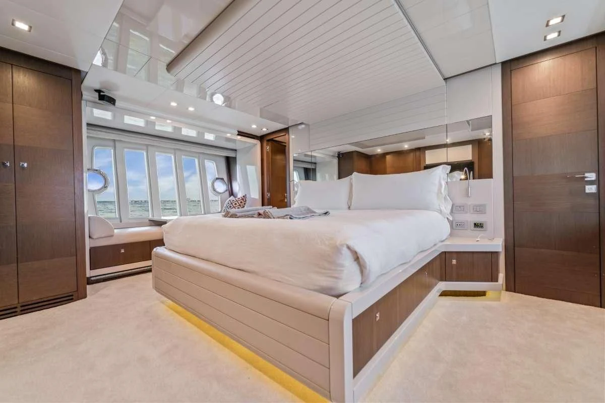 a room with a bed and a closet aboard HOYA SAXA Yacht for Sale
