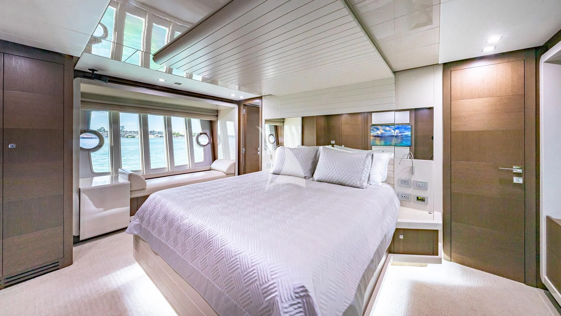 a room with a bed and a television aboard HOYA SAXA Yacht for Sale