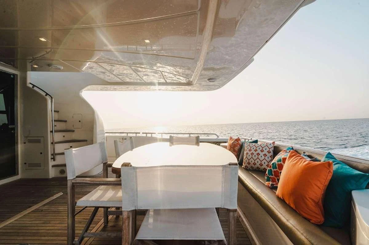 a room with a bed and a chair aboard HOYA SAXA Yacht for Sale