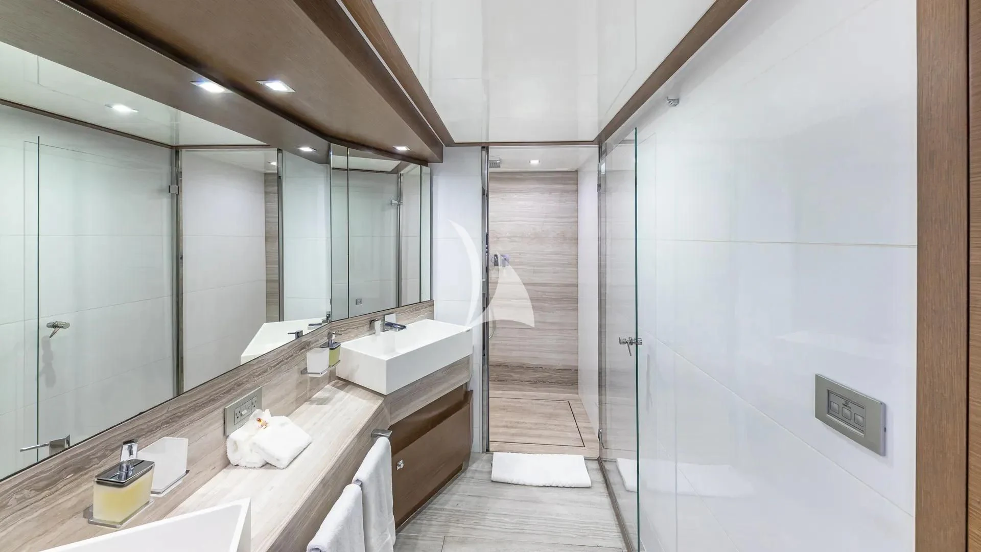 a bathroom with a large mirror aboard HOYA SAXA Yacht for Sale