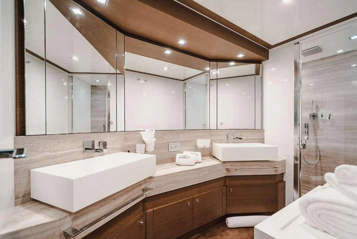 a bathroom with a large mirror aboard HOYA SAXA Yacht for Sale