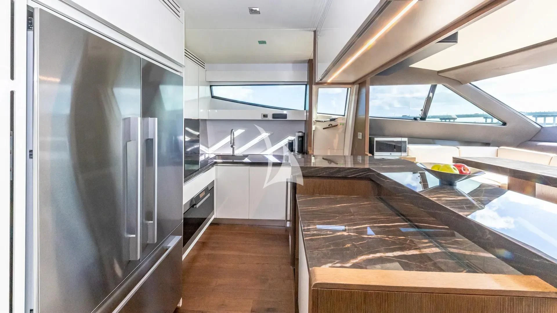 a kitchen with a large glass window aboard HOYA SAXA Yacht for Sale