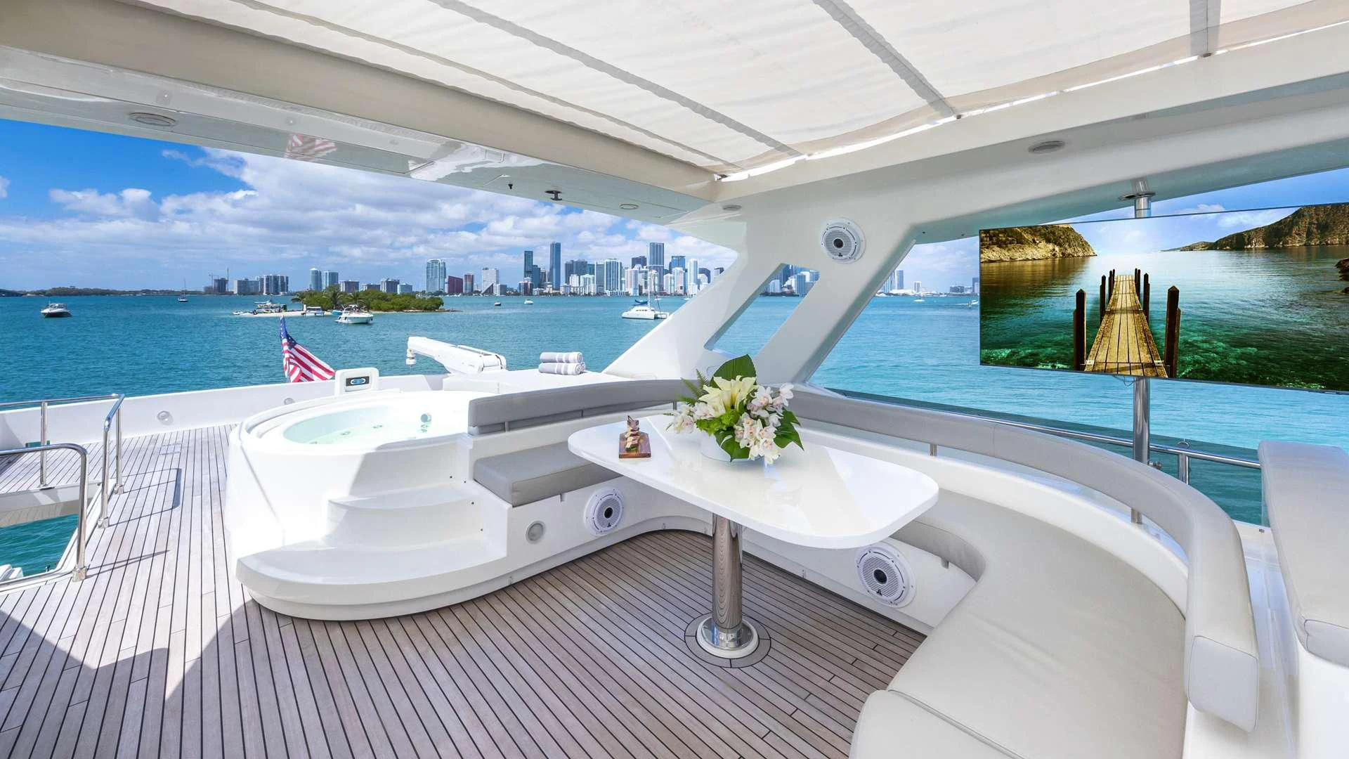 a white table with flowers on it aboard HOYA SAXA Yacht for Sale