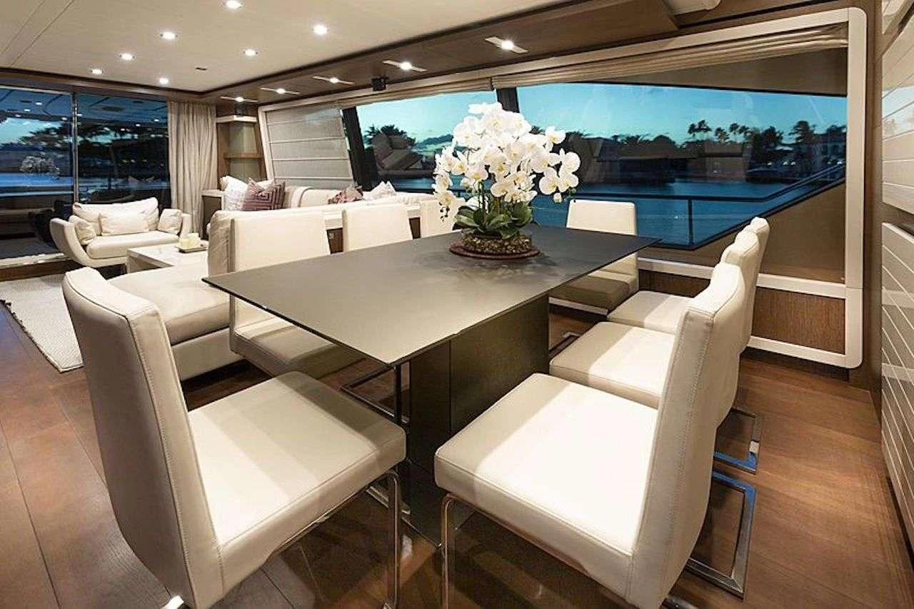 a room with a table chairs and a large window aboard HOYA SAXA Yacht for Sale