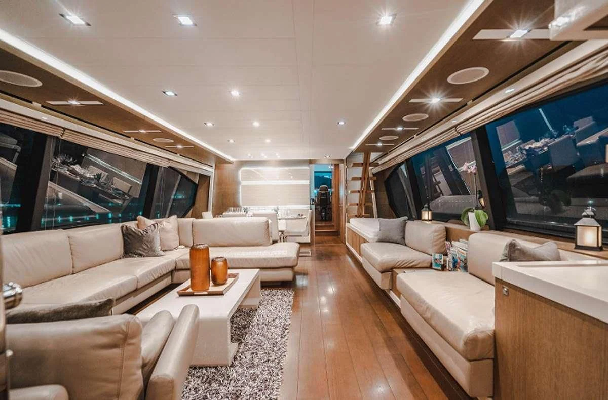a living room with a large screen aboard HOYA SAXA Yacht for Sale