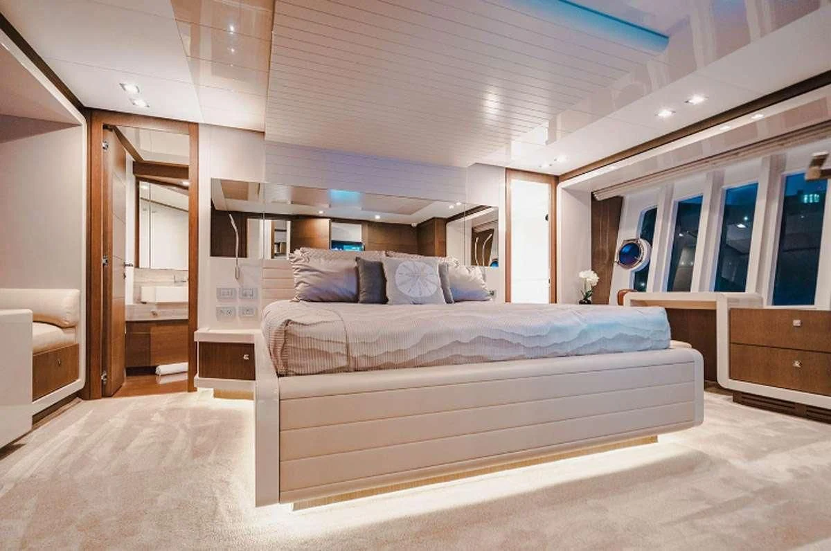 a large bedroom with a large bed aboard HOYA SAXA Yacht for Sale