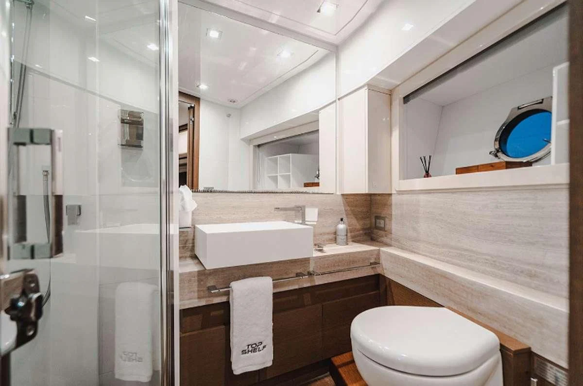 a bathroom with a large mirror aboard HOYA SAXA Yacht for Sale
