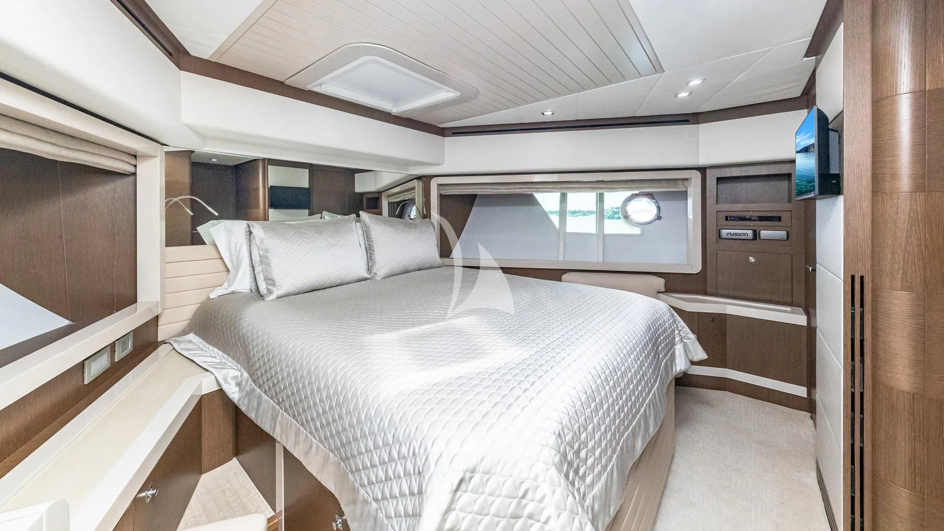 a room with a bed and a desk aboard HOYA SAXA Yacht for Sale