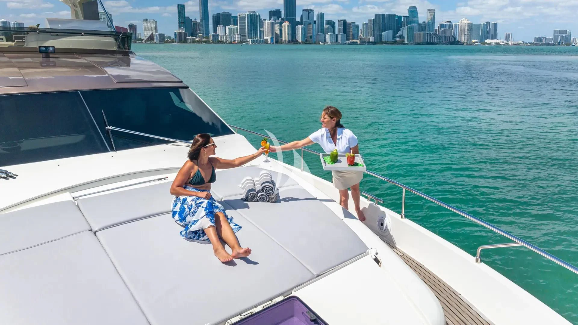 a man and woman on a boat aboard HOYA SAXA Yacht for Sale